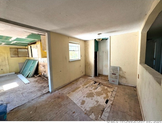 interior space with a textured ceiling