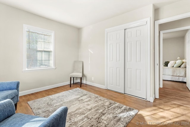 sitting room featuring light hardwood / wood-style flooring