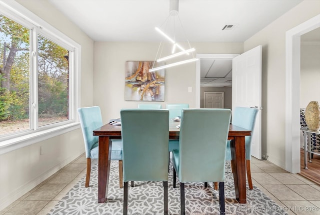 dining room featuring light tile patterned floors and plenty of natural light