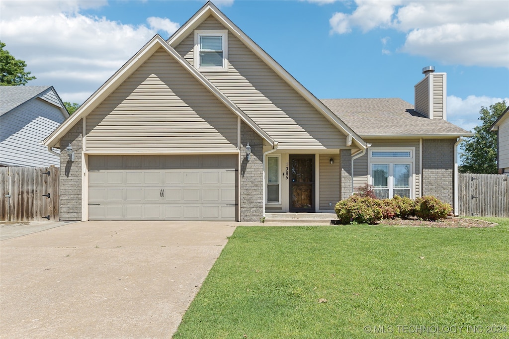 1385 E 136th St, Glenpool, OK 74033 - view of front of house featuring a front yard and a garage