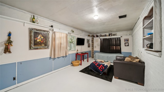 living room featuring concrete flooring