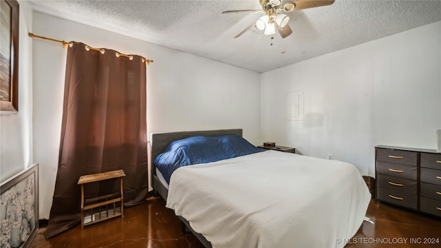 bedroom featuring a textured ceiling and ceiling fan