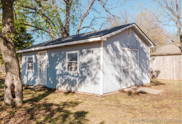 view of side of property with a shed