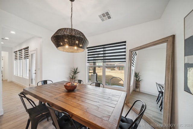 dining space featuring light wood-type flooring