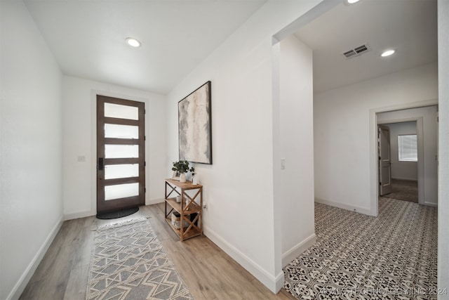 foyer entrance featuring hardwood / wood-style flooring and plenty of natural light