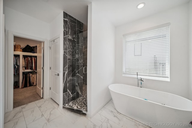 bathroom featuring plus walk in shower