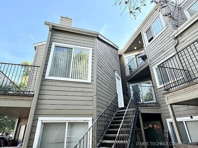 view of home's exterior featuring a balcony