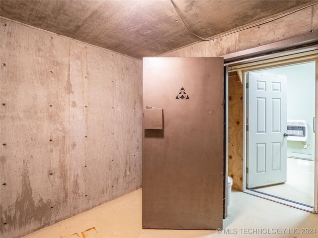 interior space with concrete floors and heating unit