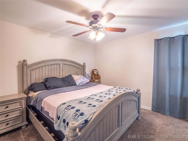 carpeted bedroom featuring a ceiling fan and baseboards