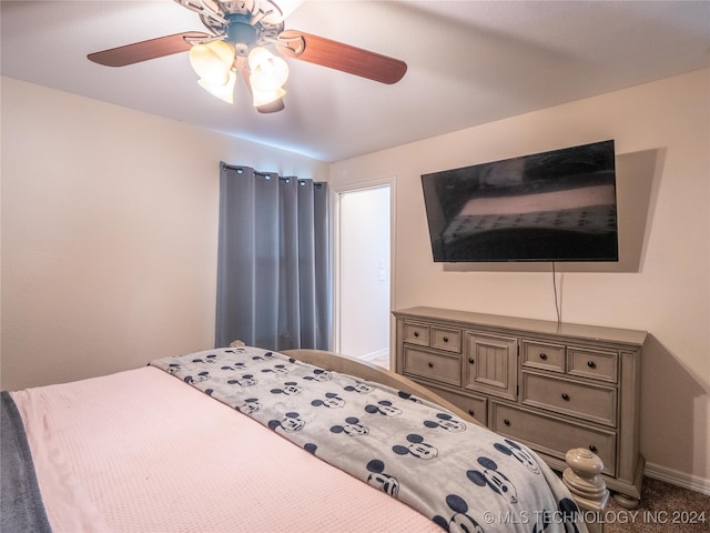 bedroom featuring ceiling fan, carpet flooring, and baseboards