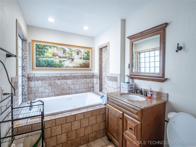 full bathroom with toilet, a garden tub, recessed lighting, and vanity