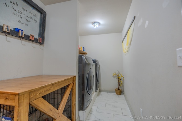 laundry room featuring washer and clothes dryer