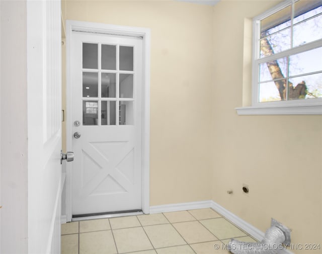 doorway to outside featuring light tile patterned floors