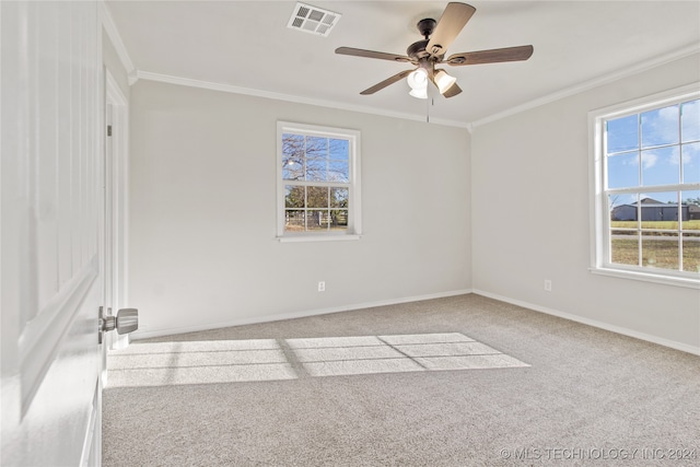 carpeted empty room featuring ceiling fan and crown molding