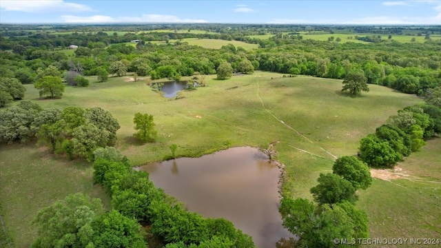 drone / aerial view featuring a water view and a rural view