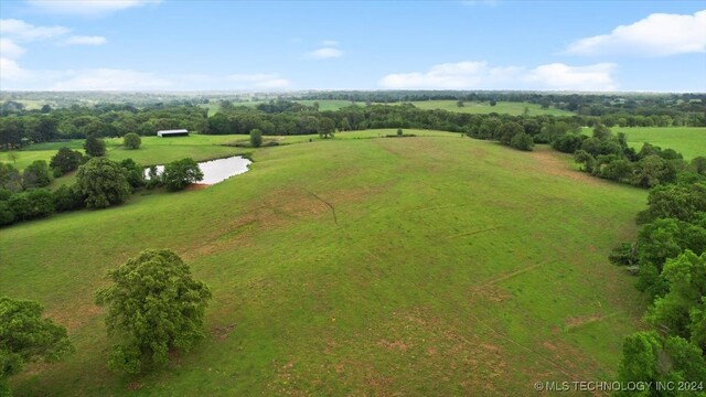 birds eye view of property featuring a rural view