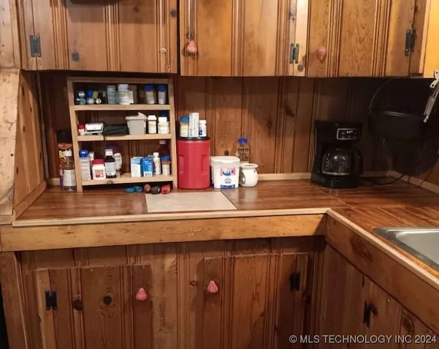 interior space featuring brown cabinets and light countertops