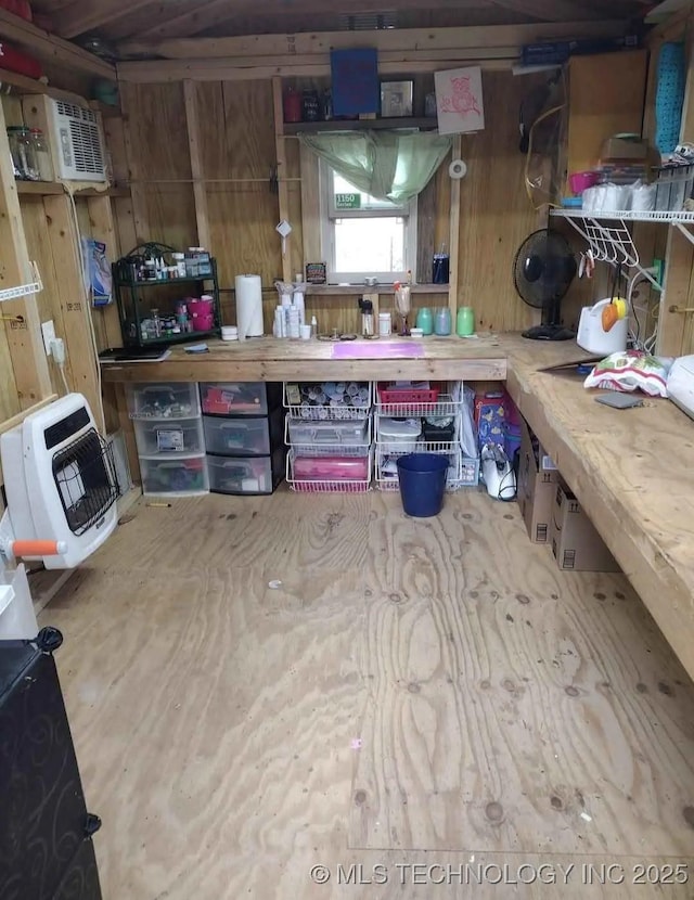 storage room featuring a wall unit AC and heating unit