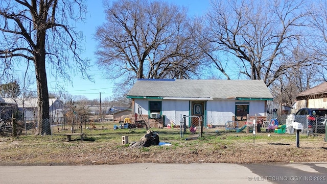 view of front of home featuring fence