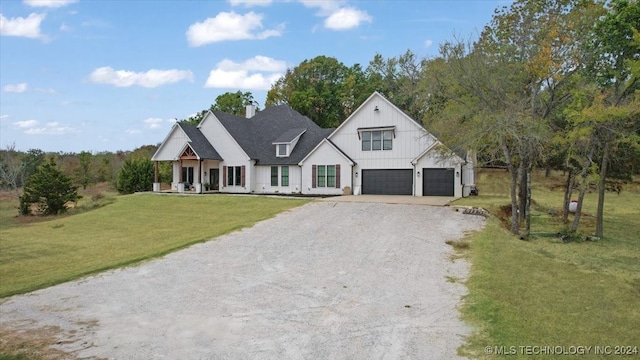 modern inspired farmhouse featuring a front lawn