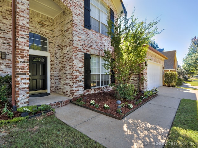 entrance to property featuring a garage