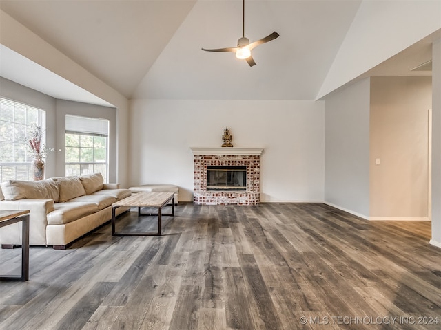 living room featuring a fireplace, ceiling fan, hardwood / wood-style floors, and vaulted ceiling