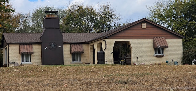 exterior space with a front yard