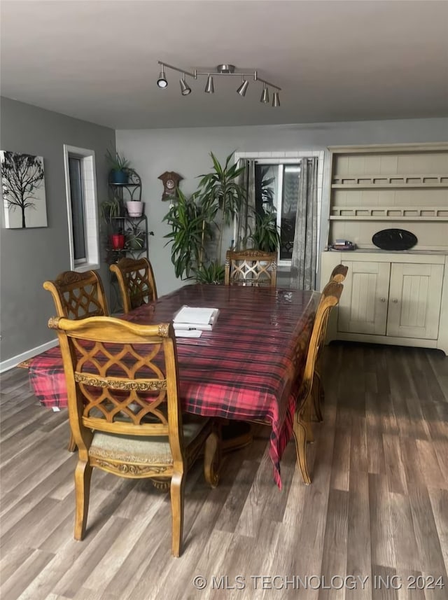 dining area with wood-type flooring