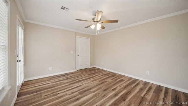 unfurnished room with ornamental molding, hardwood / wood-style flooring, and ceiling fan