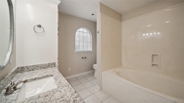 full bathroom featuring vanity, toilet, tile patterned floors, and separate shower and tub