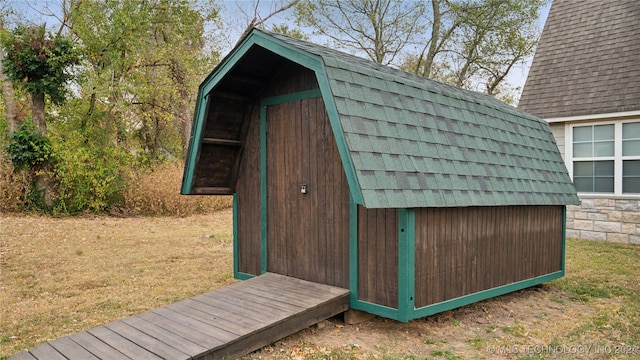 view of outbuilding featuring a yard