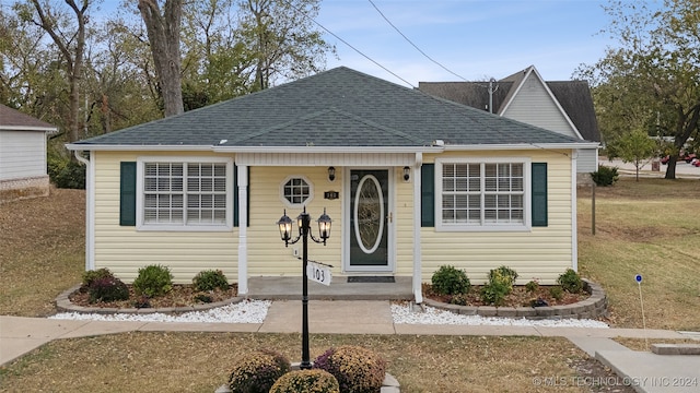 bungalow with a front lawn