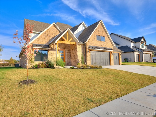 craftsman-style home featuring a front yard and a garage