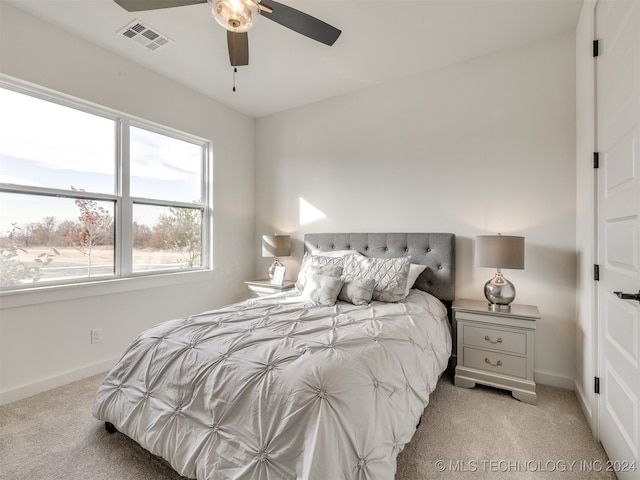 carpeted bedroom with ceiling fan