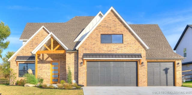 view of front of house with driveway, a shingled roof, and brick siding