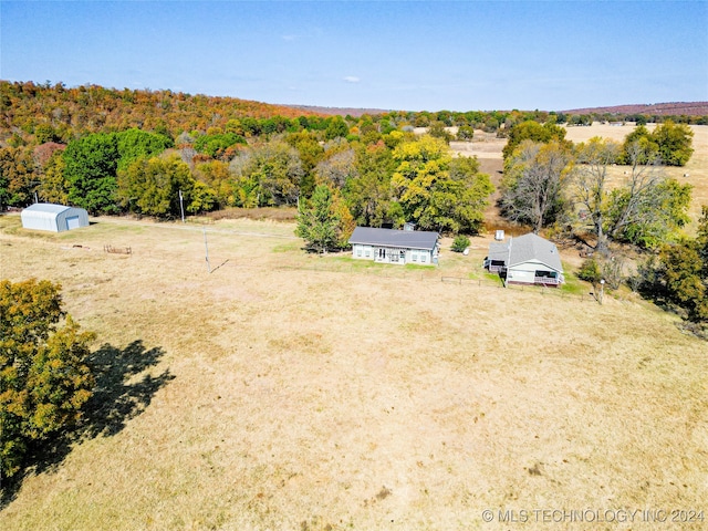 birds eye view of property with a rural view