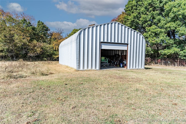 view of outdoor structure with a lawn