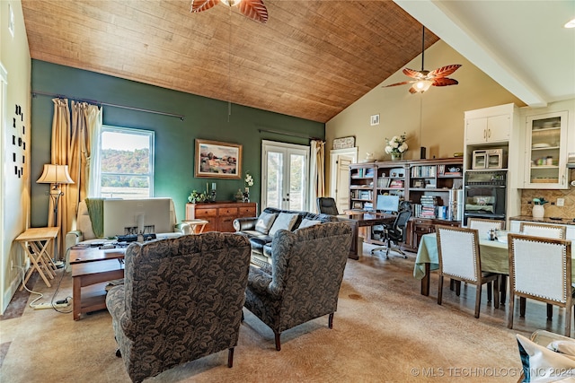 living room featuring high vaulted ceiling, light colored carpet, wooden ceiling, and ceiling fan