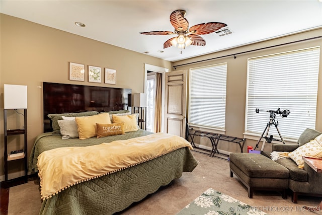 bedroom featuring light carpet and ceiling fan