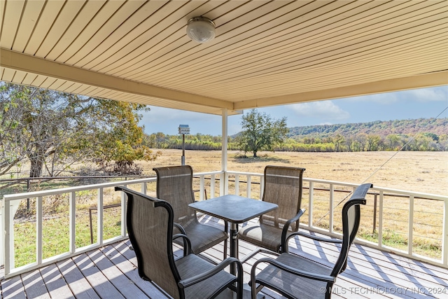 wooden terrace featuring a rural view