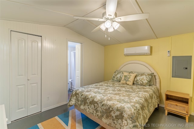 bedroom featuring lofted ceiling, a wall unit AC, ensuite bath, electric panel, and ceiling fan