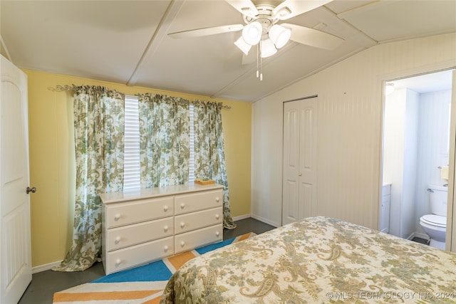 bedroom with ensuite bath, lofted ceiling, a closet, and ceiling fan