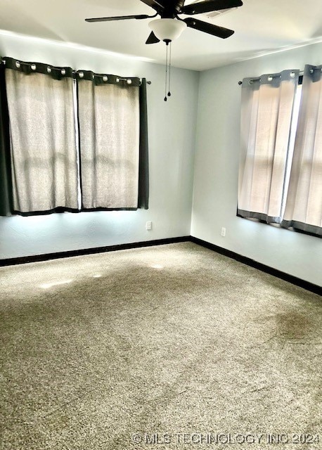 empty room with carpet and ceiling fan