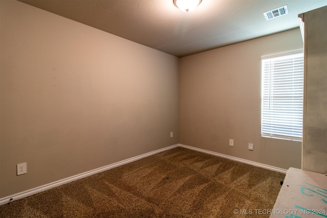 empty room with carpet flooring