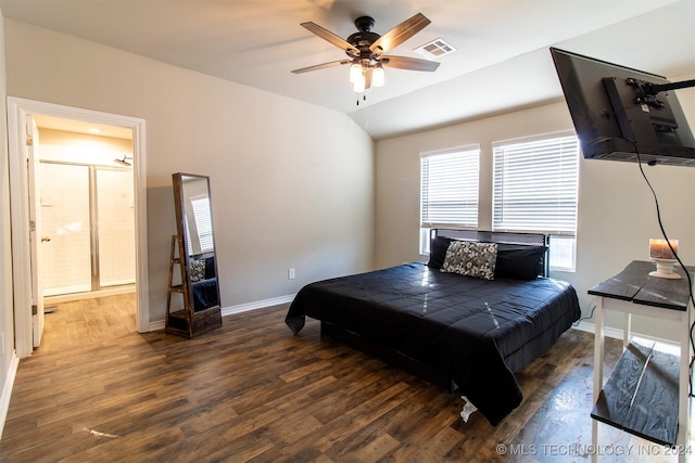 bedroom with a baseboard heating unit, dark wood-type flooring, ceiling fan, and ensuite bath