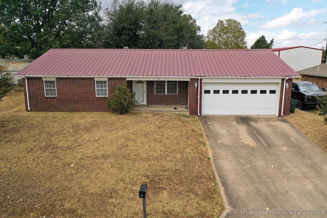 single story home with a front lawn and a garage