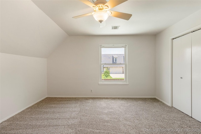 additional living space with ceiling fan, lofted ceiling, and carpet flooring