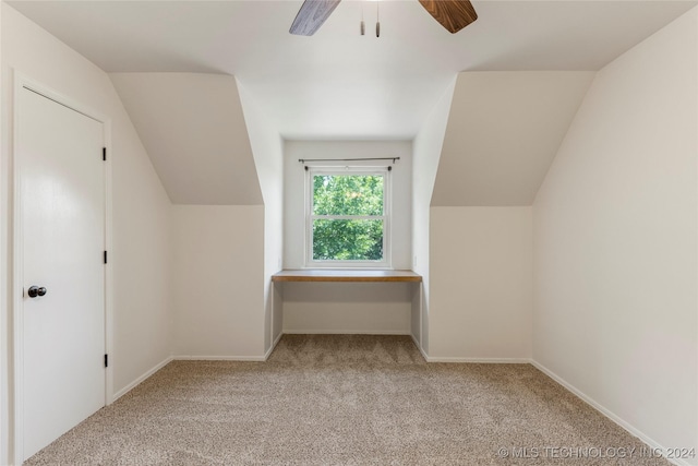 bonus room with ceiling fan, lofted ceiling, and light colored carpet