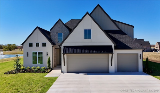 modern farmhouse style home featuring a garage and a front yard