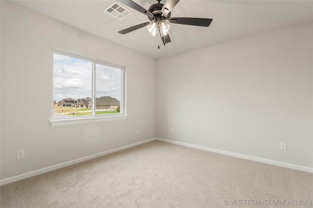 carpeted empty room with ceiling fan